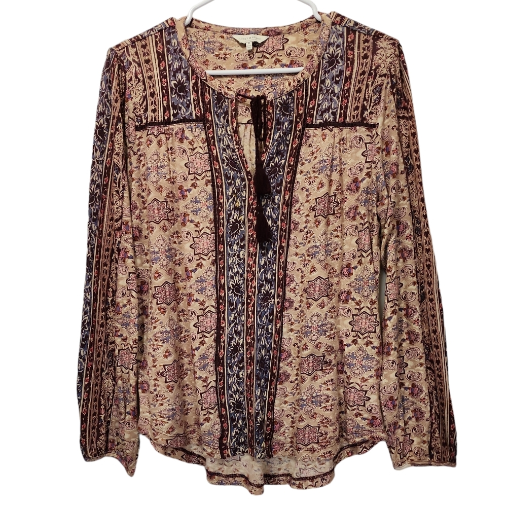 A woman's lucky brand medium.Long sleeve tie neck v key.Cut out  blouse